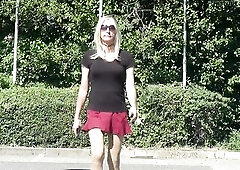 Crossdresser Sandy walk outdoors in short petticoat and high heels
