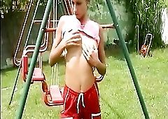 A hawt golden-haired undresses in nature's garb outdoors, widening her legs to disclose her juicy twat in advance of unleashing a ardent stream o