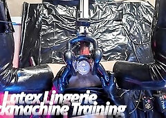 Belted into shiny ebony latex from head to toe, this babe's locked into the screwing machine for intensive training. Taut latex brassiere and mat