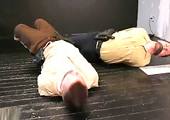 2 beefy cops bound gagged and struggling.