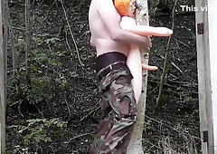 Randon Strait playing with rubber doll