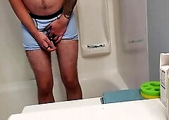 Despairing Youthful Dude Boxer Pissing in Shower