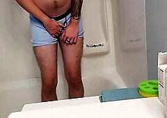 Despairing Youthful Dude Boxer Pissing in Shower