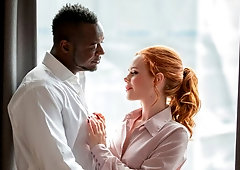 Cute redhead chick Ella Hughes sucks a long black penis on the knees