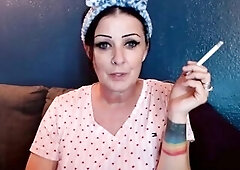 Its your fortunate day. Sit and have a fun a smoke with this pretty woman who's smokin' down on her cigarette. So yummy and relaxing. Wind d