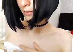 Shemale slobbers on a dildo and strokes her big shaft