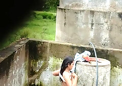 Indian Village Girl Bathing Near Water Tank Outdoor