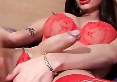 Hot tranny with huge cock strokes it while wearing lingerie