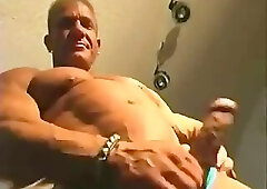 Dan Steele Stripping Out Of Blue Posing Trunks and Jacking Off