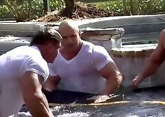 Bodybuilders Water Wrestling