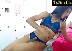 thin shemale sexy in blue outfit with high heels jerks