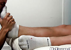 Half naked hunk lies down while a dude licks his toes too