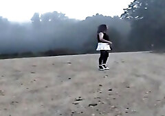 Sandy undresses on dirt road