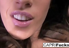 Busty brunette MILF Capri Cavanni fucks her tight wet pussy with a pink dildo