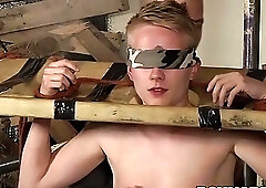 Young blond Corey Conor cannot escape BDSM blowjob wanking