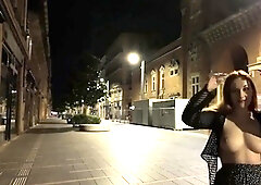 Naughty redhead teen flashing her perky tits in public
