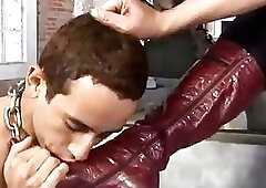 Tranny Mistress in leather corset smokes and fucks chained slave