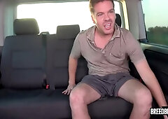 Redheaded man and brunette woman have intense sex in the backseat of a moving car