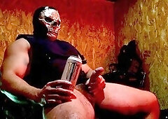 Buff guy in uniform giving himself a handjob with his massive cock