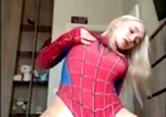 Golden-haired in taut costume rides hard and cums