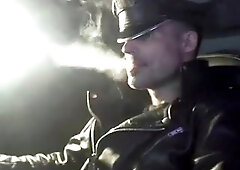 Smokin' in leather gloves and muir cap