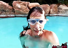 Mature brunette Sofie Marie teases her wet slit underwater in a private pool