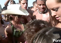 College beach party heats up with bikini teasing and passionate kissing among sun-soaked students