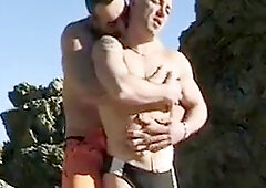 Outdoor gay act at the beach