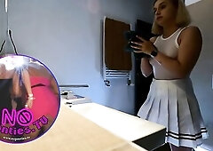 Super sexy tiny golden-haired cheerleader wears a short miniskirt with a watch throughout top to show her bazookas