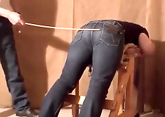 Caned over tight jeans Daddy boy