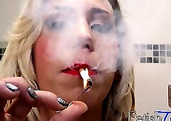 BIg breasted tranny tugging it sensually while smoking