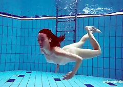 Baby Martina in a tight blue swimsuit in the pool