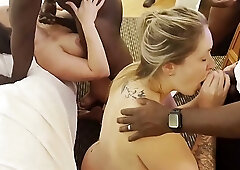 Slutty blonde babe is ready to get multiple facial cumshots while orgying with black guys