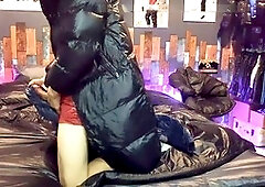 Guy in nylon shorts enjoying handjob on a shiny bed