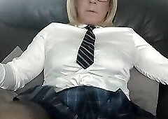 Mature crossdresser showing shaved cock and balls