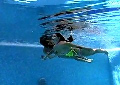 Amateur girls get undressed completely for underwater fun in the pool