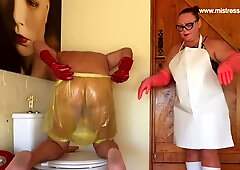 Latex-clad Mistress April degrades sissy slave with enema, whipping and pegging