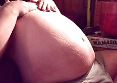 Huge man gets a big belly while sitting and inflating