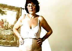 Granny in stocking dildoing her old vagina