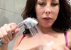 Busty babe playing with her big boobs