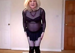 Gothic look with fishnets, miniskirt and boots