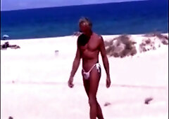 Suntanned stud on beach in lil wire panty temporarily
