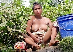 Busty Japanese bhabhi Somausha enjoys an outdoor bath in the wild