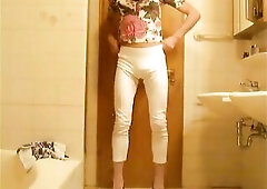 youthful slender crossdressing pissing her white panties