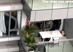 Neighbor spied topless in balcony
