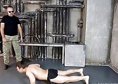 Chained thief has his back whipped during domination session