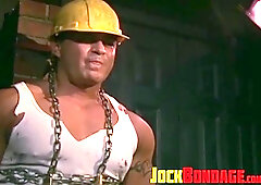 Tattooed man in uniform cant release himself from chains