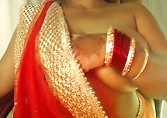 The woman reveals her naked curves and fiery boobs