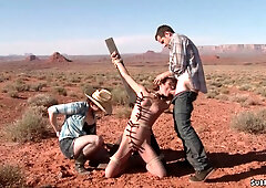 Deviant couple torment beautiful babe in desert