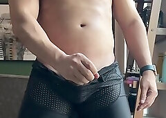 255.9 Hunk in black mesh singlet strokes his wienie